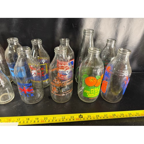 47 - Large mixed collection of vintage glass milk and dairy bottles with printed advertising, including K... 