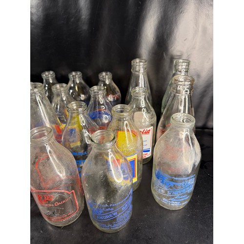 48 - Mixed group of vintage glass milk bottles with printed branding, including West Country dairies and ... 