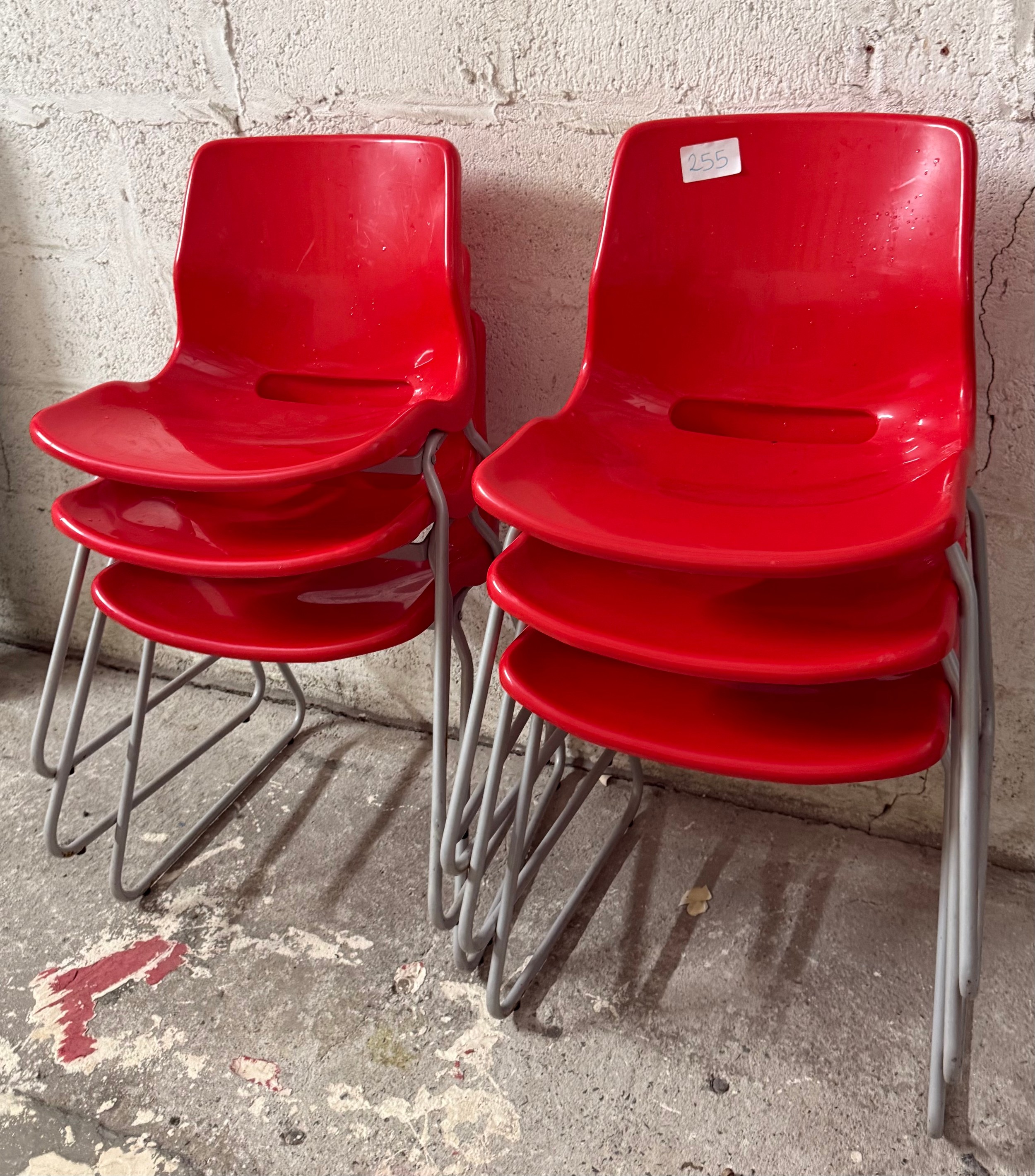 6 x red stacking chairs