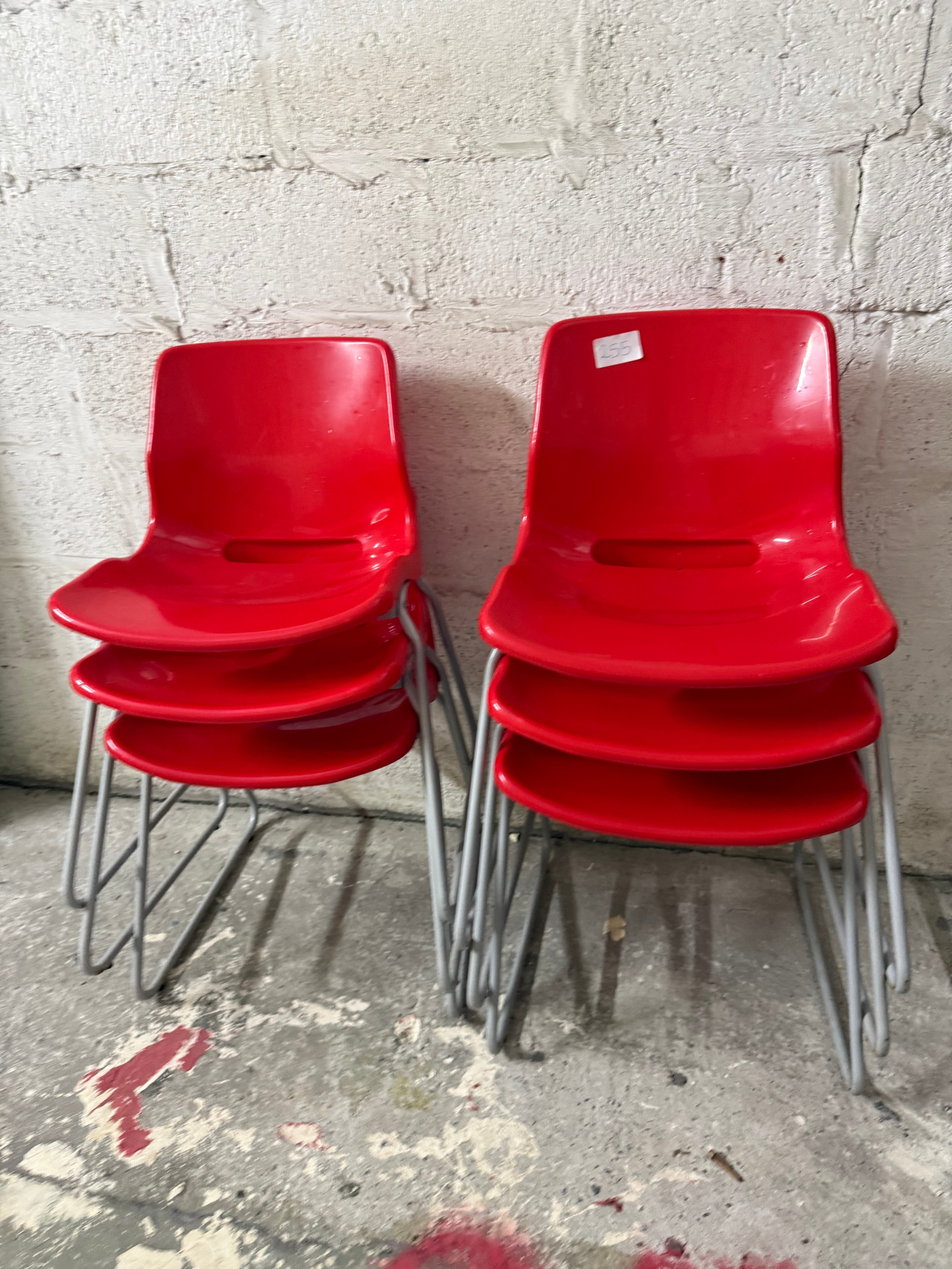 6 x red stacking chairs