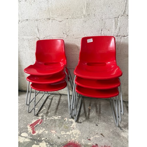 6 x red stacking chairs