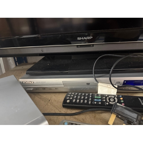 Sharp Aquos flat-screen television together with two Technika DVD ...