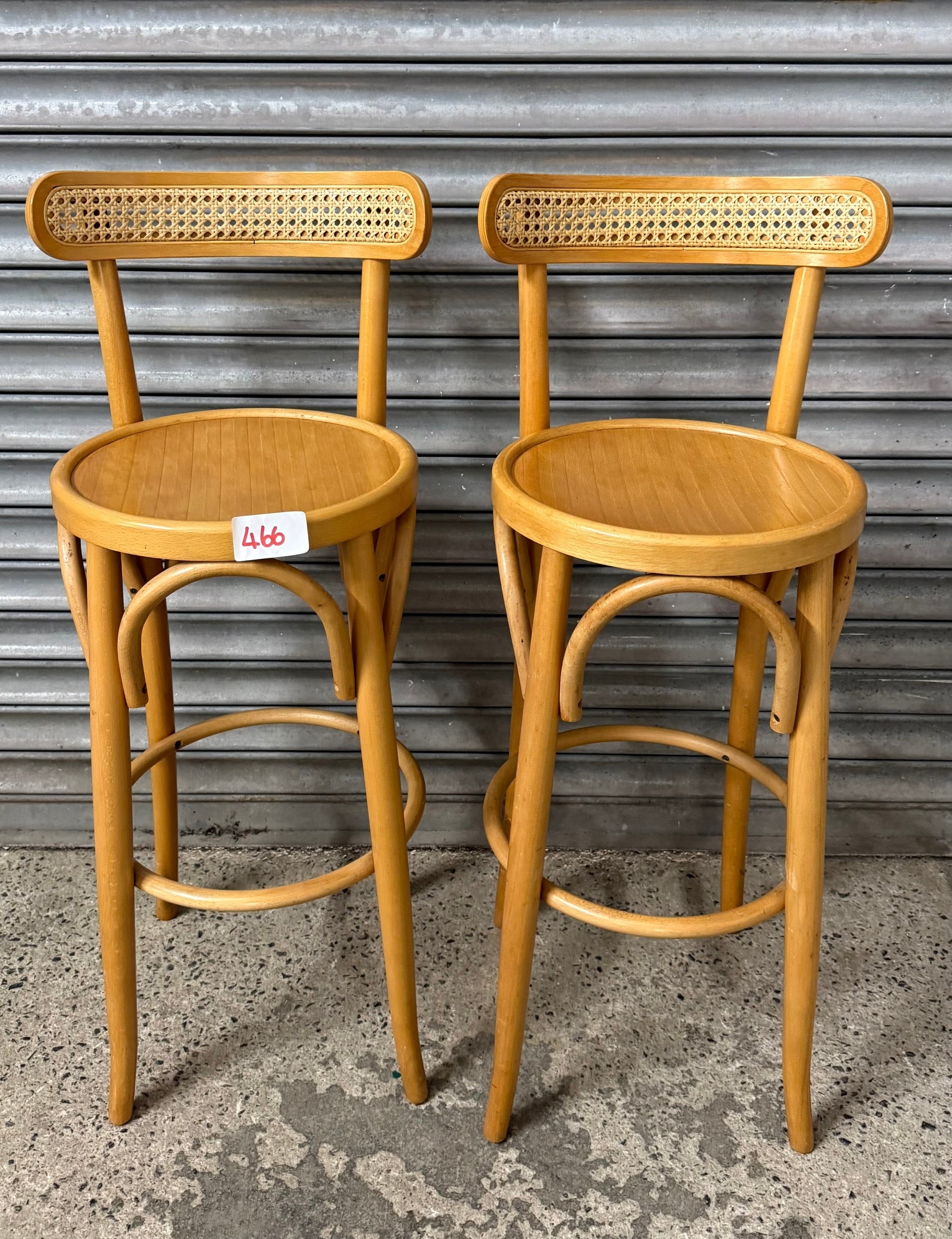 Pair of bentwood style bar stools with cane backs