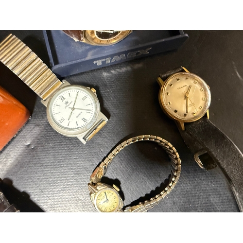 5 - A mixed collection of wristwatches to include examples by Timex, Excalibur, and other makers, togeth... 