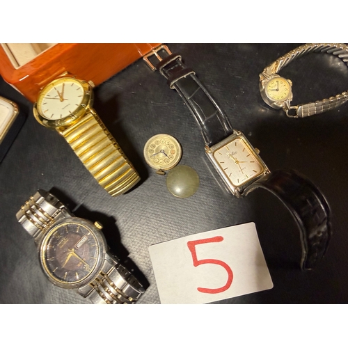 5 - A mixed collection of wristwatches to include examples by Timex, Excalibur, and other makers, togeth... 