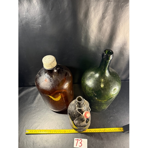73 - Three vintage glass bottles