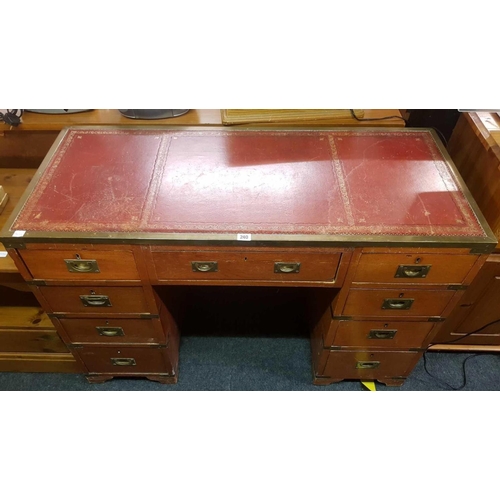 240 - RED LEATHER TOP KNEE HOLE DESK WITH BRASS EDGING & HANDLES