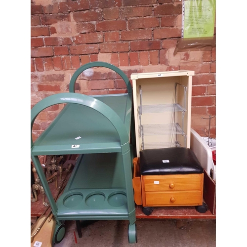 61 - GREEN PLASTIC SERVING TROLLEY, 2 DRAWER FOOT STOOL & A CREAM CABINET WITH METAL SHELVES