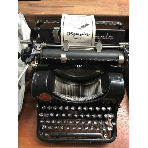 128 - TYPEWRITER OLYMPIA IN ORIGINAL BOX & BASE