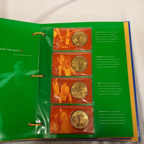 715 - FOLDER OF 28 BRONZE COINS COMMEMORATING THE SYDNEY 2000 OLYMPIC GAMES BY AUSTRALIAN MINT, CAMBRA & P... 