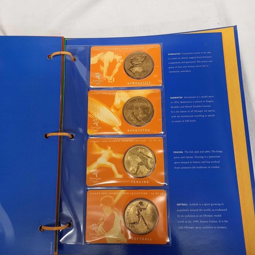 715 - FOLDER OF 28 BRONZE COINS COMMEMORATING THE SYDNEY 2000 OLYMPIC GAMES BY AUSTRALIAN MINT, CAMBRA & P... 