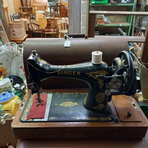 131 - SINGER SEWING MACHINE WITH KEY