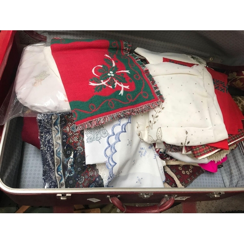 62 - SUITCASE OF MODERN MATERIAL, TABLE CLOTHS ETC