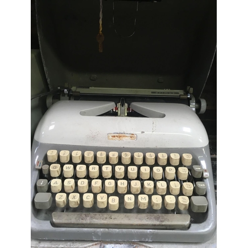 20 - VINTAGE ADLER PORTABLE TYPE WRITER IN METAL CASE