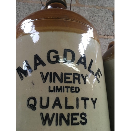 25 - TWO STONEWARE JARS, ONE WITH A SPIGOT & MARKED MAGDALE VINERY LTD QUALITY WINES