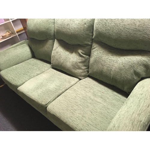 435 - THREE SEATER SETTEE, TWO MATCHING ARMCHAIRS & FOOT STOOL IN GREEN FABRIC