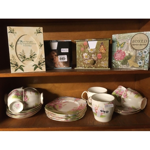 440 - SHELF OF 3 CLOCKS, 2 SHELVES OF BOXED MEMO SHEETS & A SHELF OF ROYAL ALBERT TEA WARE