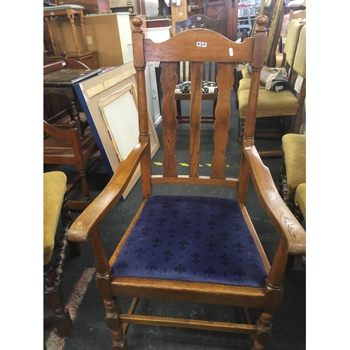 489 - TWO OAK ELBOW CHAIRS