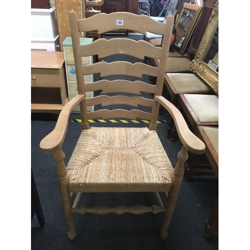 493 - WICKER LADDER BACK CARVER CHAIR WITH MAHOGANY UPHOLSTERED STRIPPED CARVER CHAIR