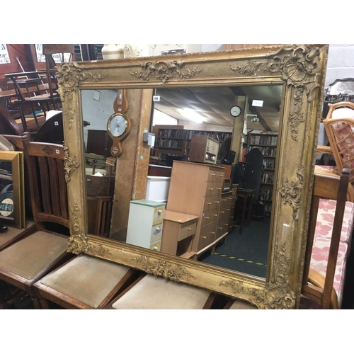 498 - LARGE HEAVILY GILDED VICTORIAN OVER MANTLE MIRROR 3ft 4'' X 3ft 6'' WITH FRAME