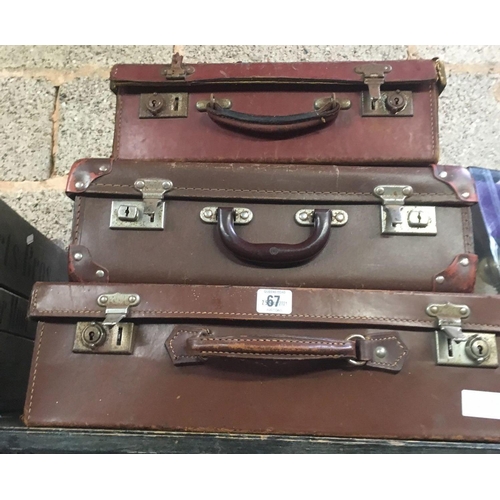 67 - STAGGERED SET OF BROWN SUITCASES