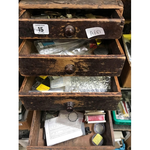 15 - OLD WOOD 4 DRAWER SPARE PARTS CABINET WITH CONTENTS OF MISC WATCH & CLOCK PARTS