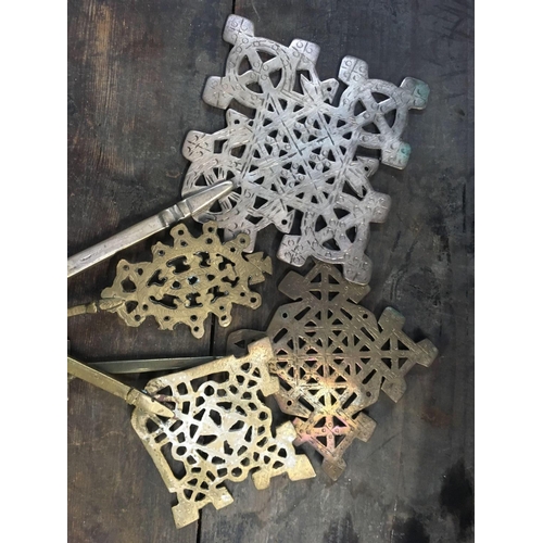 12 - 4 BRASS & WHITE METAL RELIGIOUS CROSSES, BRASS BUTTON STICK & SMALL BRASS WIRE BASKET