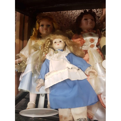 53 - SHELF OF MISC PORCELAIN DOLLS ON STANDS & 1 OTHER PLASTIC IN BOX