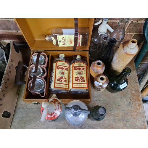 210 - QTY OF OLD BOTTLES & SODA SYPHON'S & BROWN CASE CONTAINING GORDONS GIN BOTTLES