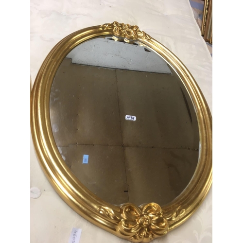 489 - PAIR OF GILT FRAMED OVAL BEVELLED EDGE MIRRORS