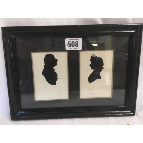 508 - A PAIR OF ANTIQUE SCISSOR CUT PORTRAIT SILHOUETTES OF A LADY AND GENTLEMAN IN ONE FRAME.