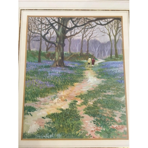 523 - WATERCOLOUR OF FIGURES IN A BLUEBELL WOOD, SIGNED TOM GRIFFITHS