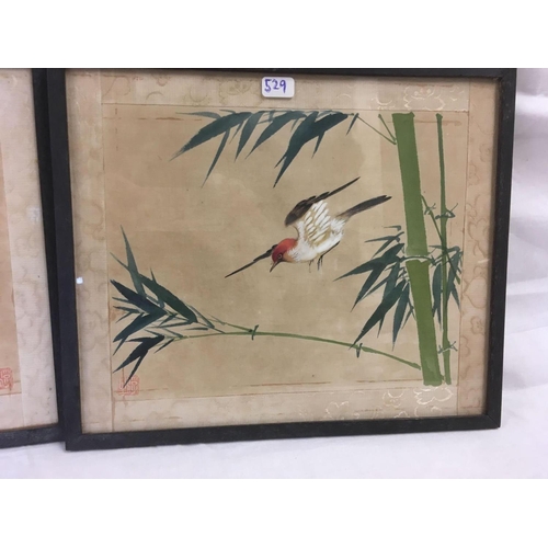 529 - PAIR OF ORIENTAL WATERCOLOURS OF BIRDS ON BAMBOO BRANCHES. SIGNED WITH RED SEALS