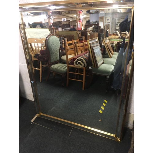 608 - GILT FRAMED BEVELLED EDGE WALL MIRROR (MISSING A GOLD COLOURED LEAF)