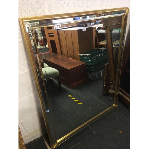 608 - GILT FRAMED BEVELLED EDGE WALL MIRROR (MISSING A GOLD COLOURED LEAF)