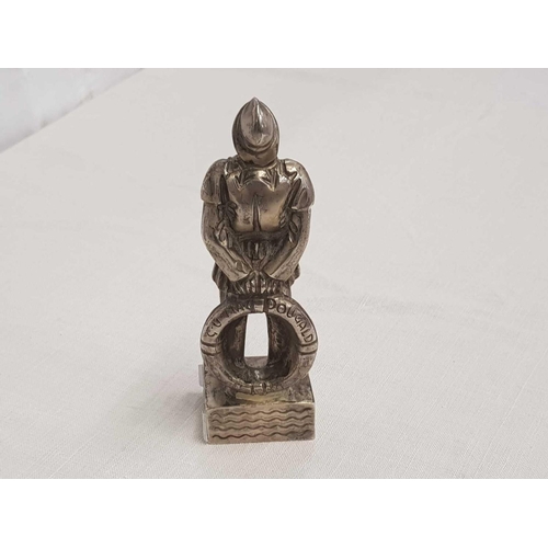 766 - WHITE METAL FIGURE OF A LIFE BOAT MAN BEING AN AWARD TO MISS LILIAN DOWZER FOR WORK FOR THE LIFE BOA... 