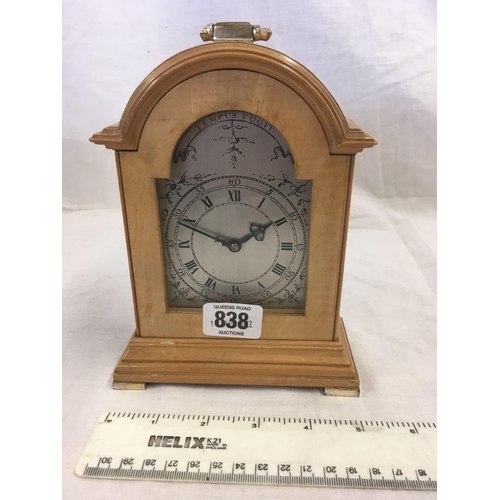 838 - SMALL WOODEN CARVED MANTEL CLOCK