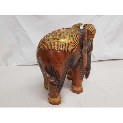 858 - CARVED WOODEN MODEL OF AN INDIAN ELEPHANT