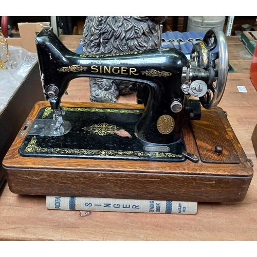 116 - VINTAGE  SINGER SEWING MACHINE IN OAK CARRYING CASE WITH BOOK