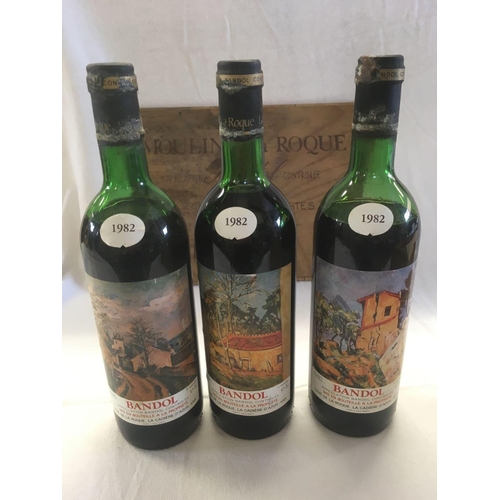 927 - WOOD CASE WITH 3 BOTTLES OF 1982 BANDOL WINE, 2 ULLAGED MID TO LOW SHOULDER