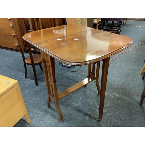 286 - MAHOGANY SUTHERLAND TABLE WITH BRASS CASTERS TO GATE LEGS