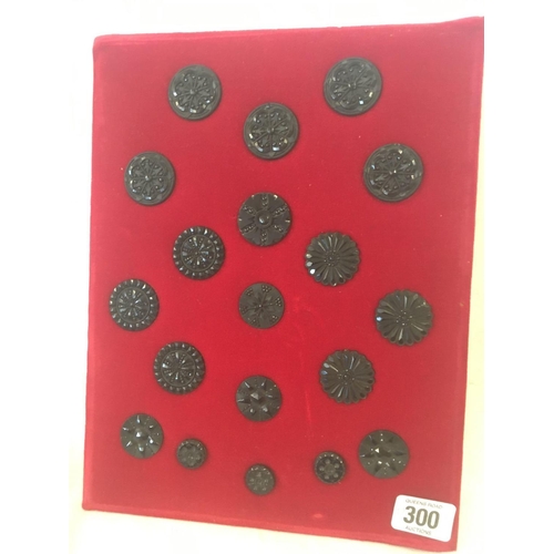 300 - 3 PLUSH VELVET DISPLAY BOARD OF 19 PATTERNED JET BUTTONS, 9 BRASS BUTTONS & NUMEROUS M.O.P BUTTONS