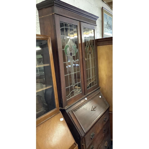 457 - ART NOUVEAU BREAK FRONT BUREAU BOOKCASE WITH LEADED STAINED GLASS DOORS & 3 DRAWERS WITH ORNATE DROP... 