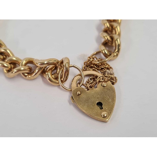 666 - A CURB LINK BRACELET WITH HEART SHAPED PADDLOCK