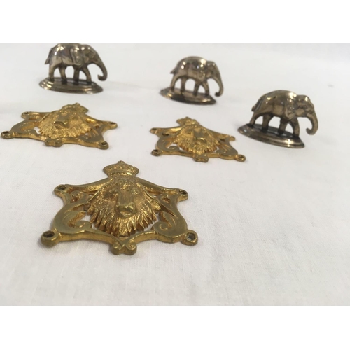 765 - 2 BUFFALO HEAD MEDALLIONS & 4 WHITE METAL ELEPHANT