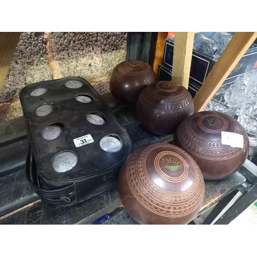 31 - SET OF BOULE'S IN CARRIER & 4 BROWN LAWN BOWLS