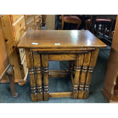 319 - CARVED OAK NEST OF 3 TABLES BY BRIGHT'S OF NETTLEBED