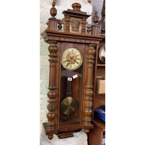 339 - CARVED MAHOGANY VIENNA STYLE STRIKING WALL CLOCK WITH BRASS & ENAMEL FACE