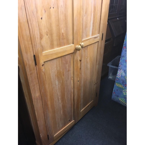 466 - STRIPPED PINE DOUBLE WARDROBE WITH HANGING RAIL & SHELF, 25'' WIDE