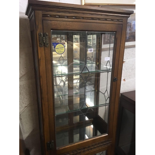 468 - TALL NARROW OAK DISPLAY CABINET BY OLD CHARM WITH LEADED GLASS DOORS